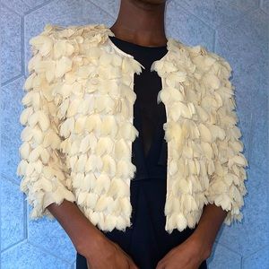 Feathered bolero/shrug that’s a guaranteed show stopper! Size Medium